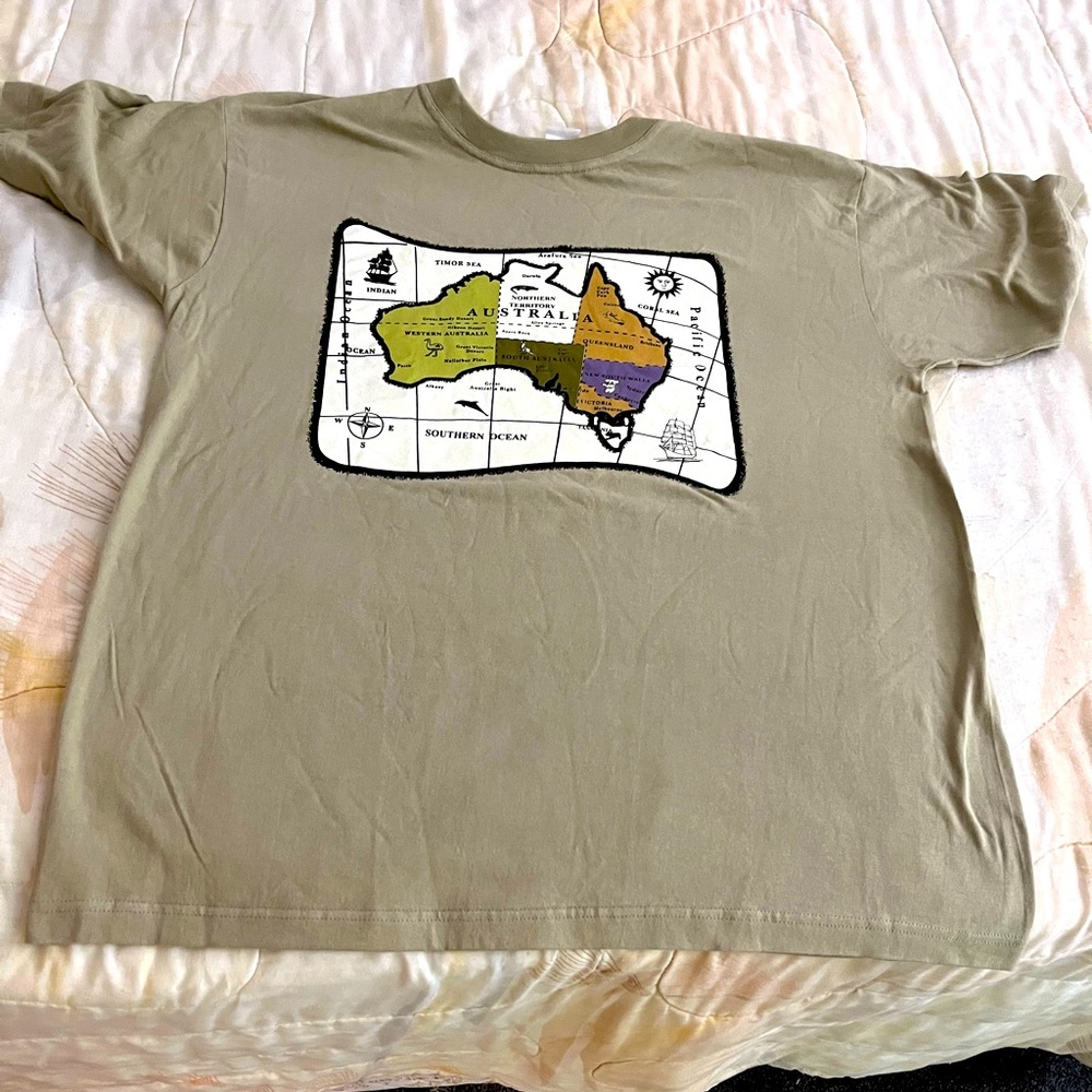 The T-shirt is brand is Australia. It’s tan and 2xl
